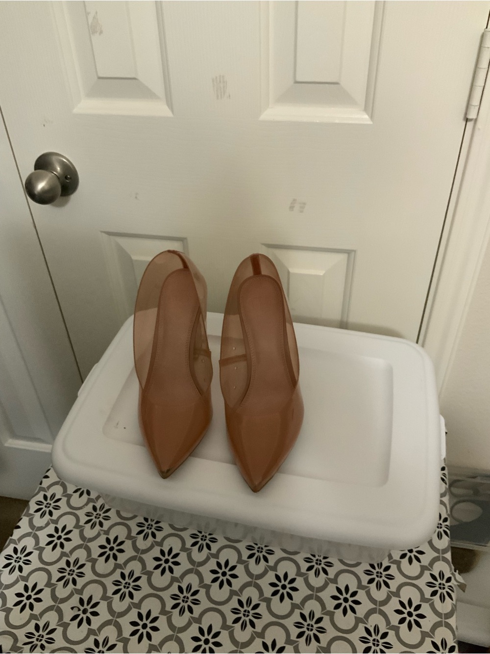 Gianni Bini nude clear vinyl pumps feature a distinct Lucite block heel